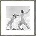 Two Women Fencing On Rooftop Framed Print