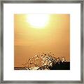 Wave Crashes Against Sunrise Framed Print