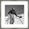 Woman Skier Standing On Slopes Framed Print
