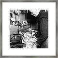 Woman Using Paper Money To Light Stove Framed Print