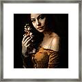 Woman With Orchid Framed Print