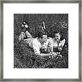 Young Couple Lying In The Grass Framed Print