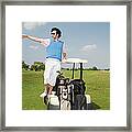 Young Man Standing On Golf Cart Framed Print