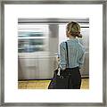 Caucasian Woman Standing Near Passing Subway In Train Station #1 Framed Print