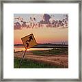 Dodged A Bullet - Curve In Road Sign With Sunlight Through Bullet Hole Framed Print