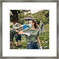 Group Of Volunteers With Surgical Masks Cleaning Nature Together #1 Framed Print