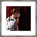 Young Woman Peeking Through Stage Curtain #1 Framed Print