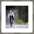 A Woman Rides Her Road Bike Along The Trans Canada Trail Bikepath Near Canmore, Alberta, Canada In The Autumn. #2 Framed Print