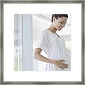 Pregnant Woman Holding Stomach Framed Print