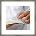 A Man Reading The Holy Bible.a Man Reading A Book. Framed Print
