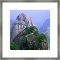 A Rocky Outcropping Overlooks A Mist-covered China Mountain Range Framed Print