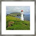 A Small White Lighthouse Wit A Red Roof On Top Of Grassy Cliffs Of Mykines Island Framed Print