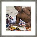 African Man Reading Book On Beach Framed Print