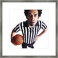 An African American Male Referee Blows His Whistle As He Looks Up At The Camera Framed Print