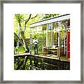 Architect In Home Office Looking At Smart Phone Framed Print