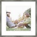 Bearded Hipster And Girlfriend Relax In Park, Make A Rest Framed Print