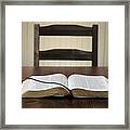 Bible Sitting Open On A Table In Front Of An Empty Chair Framed Print