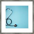 Black Stethoscope On Blue Background Framed Print