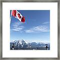 Canada, Alberta, Banff National Park, Canadian Flag Blowing Above Viewing Deck, Mountain Range In Background Framed Print