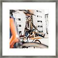 Carefree woman with man riding bicycle in the city Framed Print
