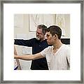 Caucasian Artist Teaching Student In Studio Framed Print