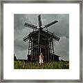 Caucasian Teenage Girl Standing Under Wooden Windmill Framed Print