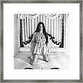 Cher On A Canopy Bed Framed Print