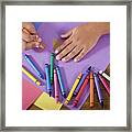 Close Up Hands Of Child Drawing With Colorful Crayons Framed Print