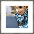 Close-up Of A Happy, Indian Boy Using Laptop Framed Print