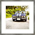 Couple Driving Retro Car Down The Road Framed Print