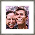 Couple Laughing In Rain Under Purple Umbrella Framed Print