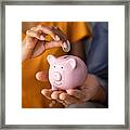 Couple Saving Money In Piggybank Framed Print