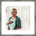 Doctor Using Stethoscope While Examining Patient Framed Print