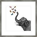 Elephant Blowing Butterflies Framed Print