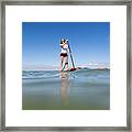 Family Stand Up Paddleboarding On The Isle Of Wight. Framed Print