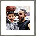 Father Takes Selfie While Son Holds A Basketball On Head Framed Print