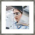 Female Industrial Worker Working With Manufacturing Equipment In A Factory Framed Print