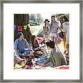 Friends Hanging Out Relaxing On Blanket In Park Framed Print