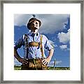 Germany, Bavaria, Farmer Standing In Field And Looking Away Framed Print