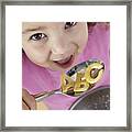 Girl Eating Alphabet Pasta Framed Print