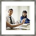 Group Of Coworkers In Discussion In Office Framed Print