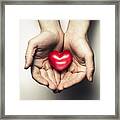 Hands Cupping A Heart Framed Print