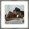 Happy Affectionate Couple In Bed Framed Print