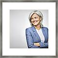 Happy Businesswoman With Arms Crossed Looking Away Framed Print