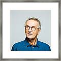 Headshot Of Thoughtful Senior Man Framed Print