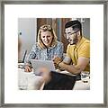 Hipster Young Man Showing Female Colleague Laptop Framed Print