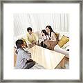 Japanese Family Relaxing In Their Home Framed Print