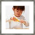 Japanese Girl Cutting Paper With Scissors (3 Years Old) Framed Print