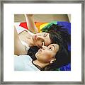 Lesbian Couple Lying Over Rainbow Flag Framed Print