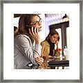 Lifestyle Photograph Of An Attractive Caucasian Female As She Talks On A Cell Phone In A Cafe Framed Print